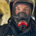 Man in helmet and breathing protection gear - Mask fit testing